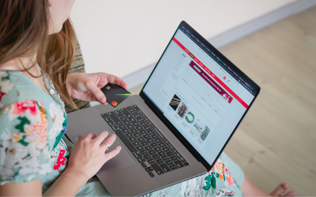 Woman using a laptop to review website content and online marketing information.